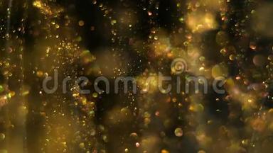 神奇的微小圆形模糊的金色粒子闪闪发光，在黑色的空间背景上缓慢而随机地移动。